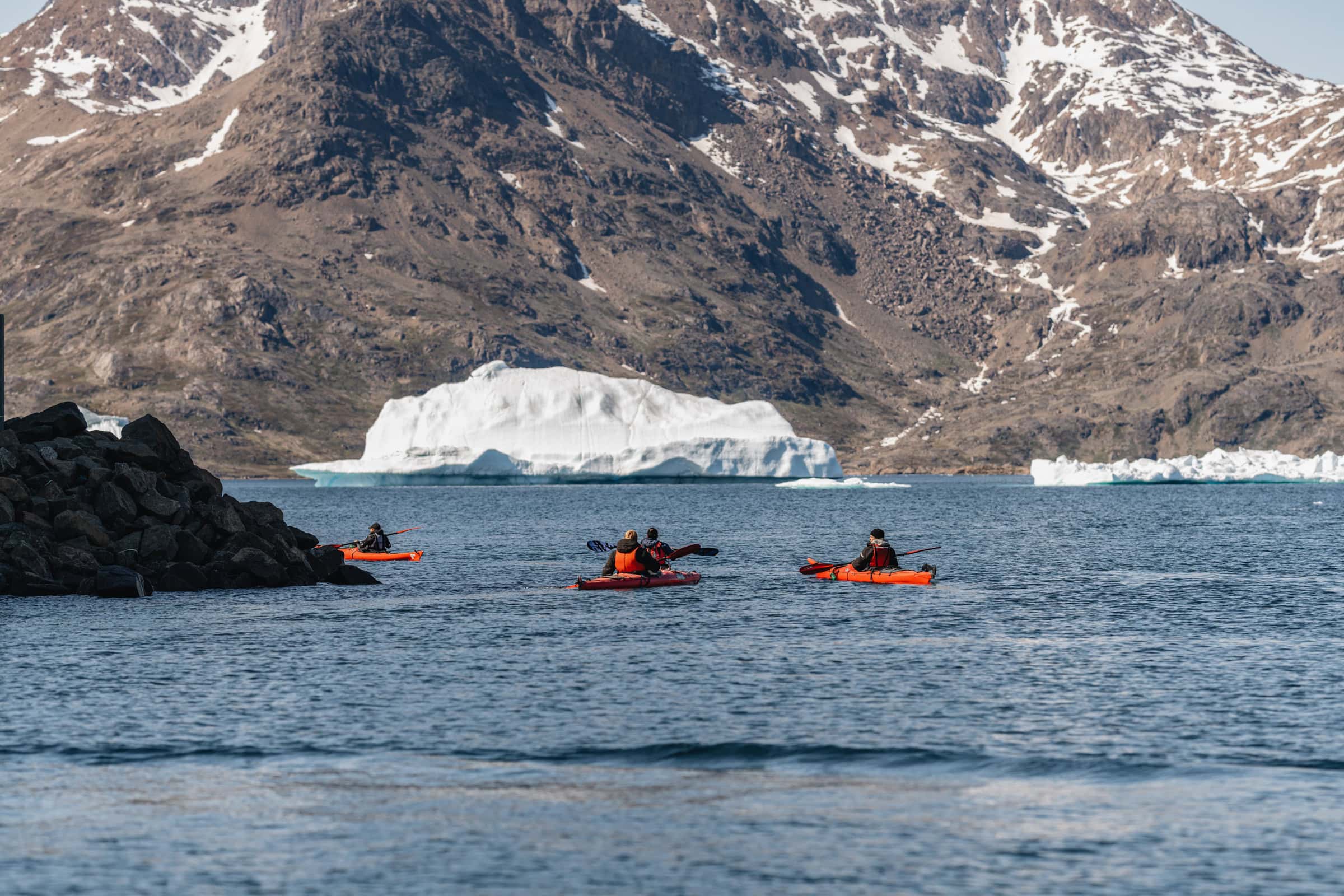 Sea kayaking among icebergs